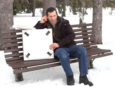 Homemade/DIY portable loop antenna crystal radio in a pizza box.