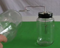 Testing the polarity of the bottom of the electret using my inductively charged homemade/DIY electroscope.