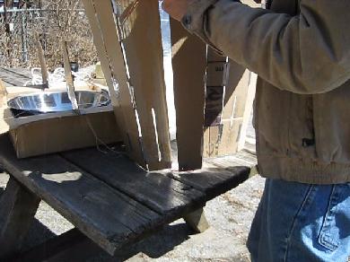 Assembling the solar cooker cone.