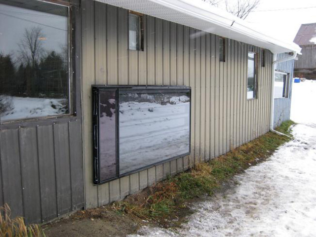 Commercial Solarsheat solar air heater on a horse barn.