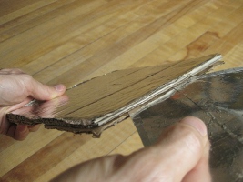 Inserting a reflector in between the base's two pieces for
      the Copenhagen solar cooker.