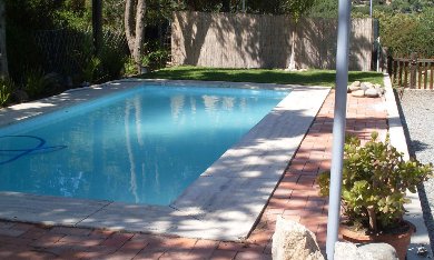 The pool that's being heated using the DIY/homemade solar pool heater.