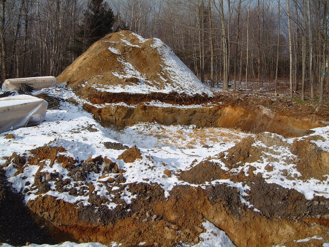 Hole dug for the concrete foundation for the wind turbine.