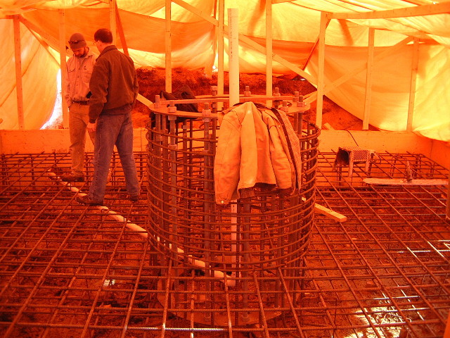 The rebar covered floor inside the tarp building.