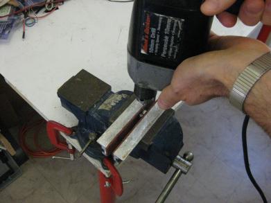 Drilling the holes in the bicycle lock key.