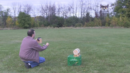 Holding the wire while the hexacopter rises.