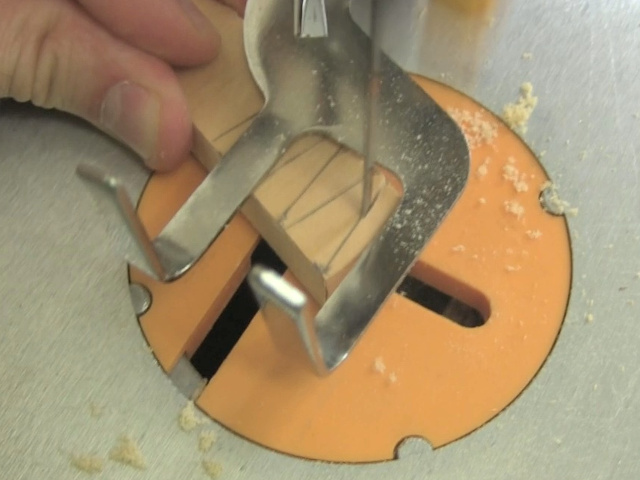 Cutting out the wedges on a scroll saw.