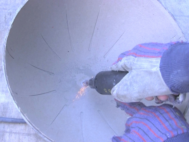 Grinding metal inside leftover from the cardboard globe.