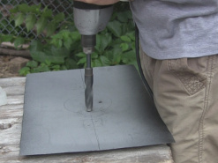 Drilling holes in the Stirling engine's steel plate.