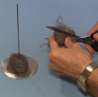 Cutting the steel wool for the stirling engine's displacer.