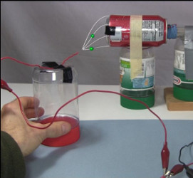 The conductive electric field in the gap for supplying ions to the corona motor.