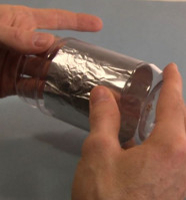 Put the foil inside the corona motor's jar.