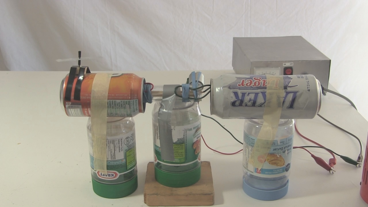 The ion wind rotor spinning on a small Van de Graaff generator.