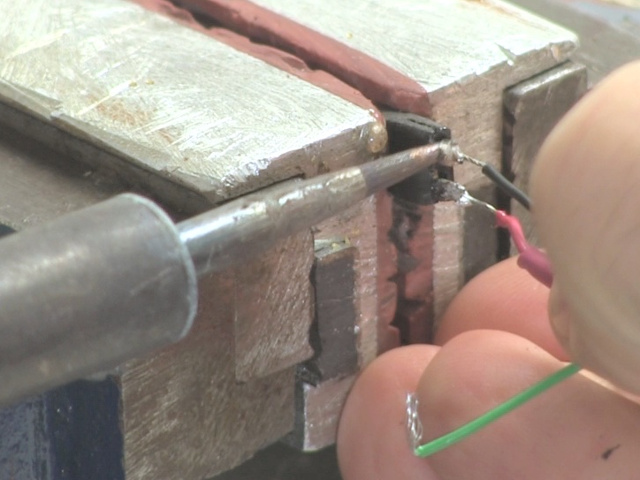 Soldering the wires of the USB cable to the female pin header.