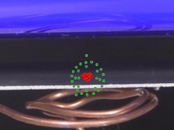 Electron emitted from the metal plate to demonstrate the photoelectric effect.