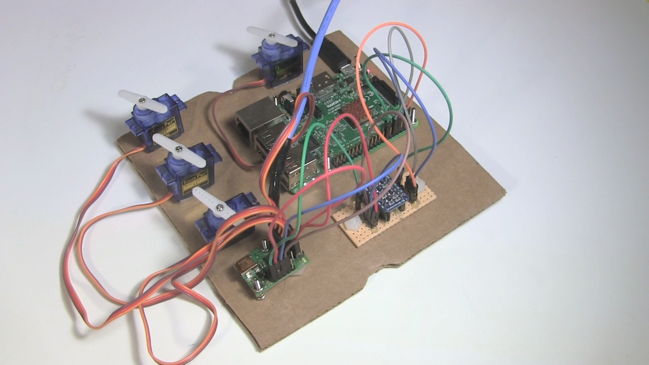 Maestro and Raspberry Pi, with a BSS138 level-shifter in between, controlling four servos.