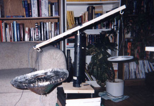 T.T. Brown Bahnson labs test diagram with saucer suspended
      using a balance.